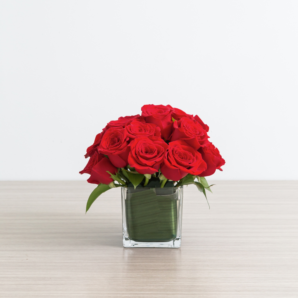 Classic red roses in a cube vase