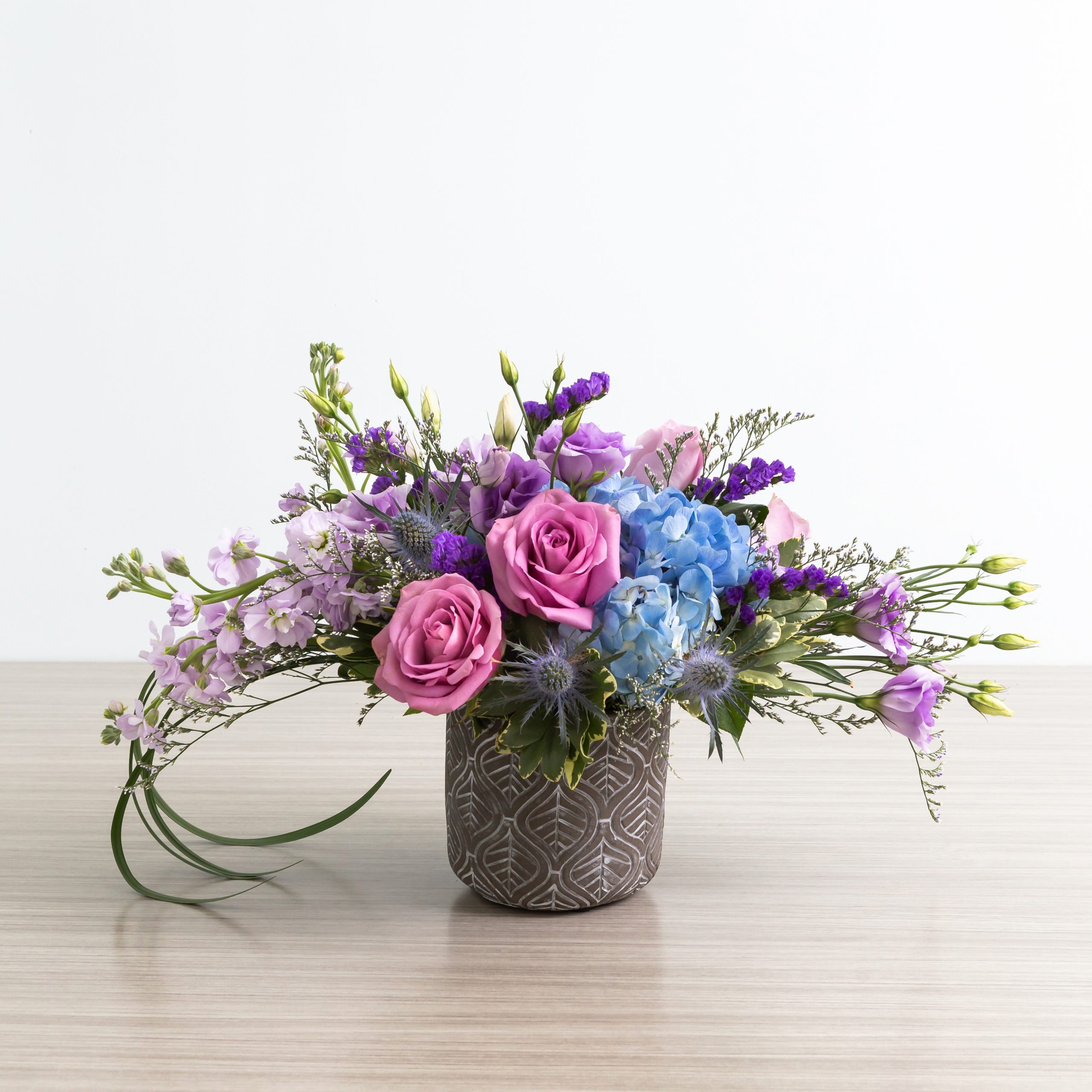 Floral arrangement with Blue dream roses and blue hydrangeas and lisianthus