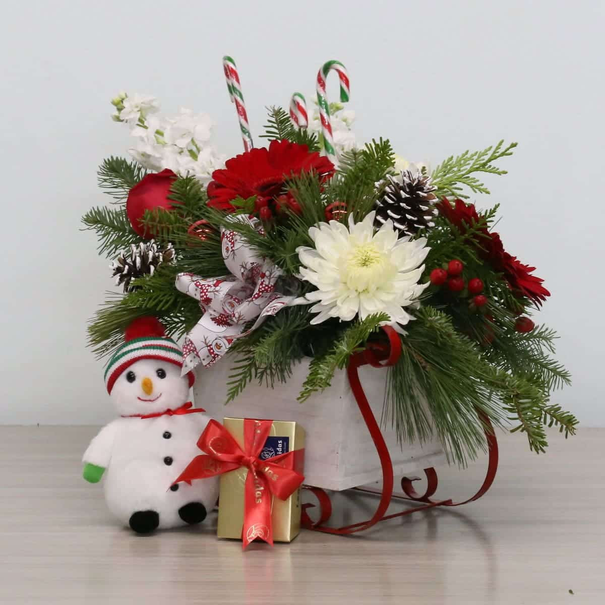 Holiday Sleigh Surprise – Christmas Floral Arrangement