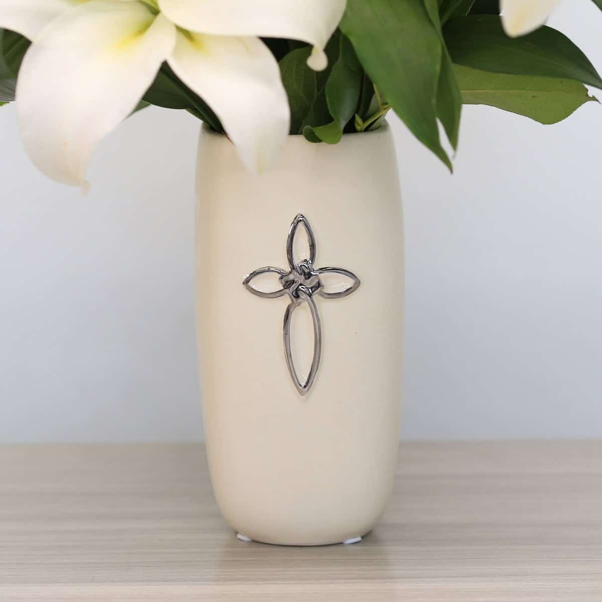 Ceramic sympathy vase with cross detail used in Faithful Blessing Bouquet arrangement.