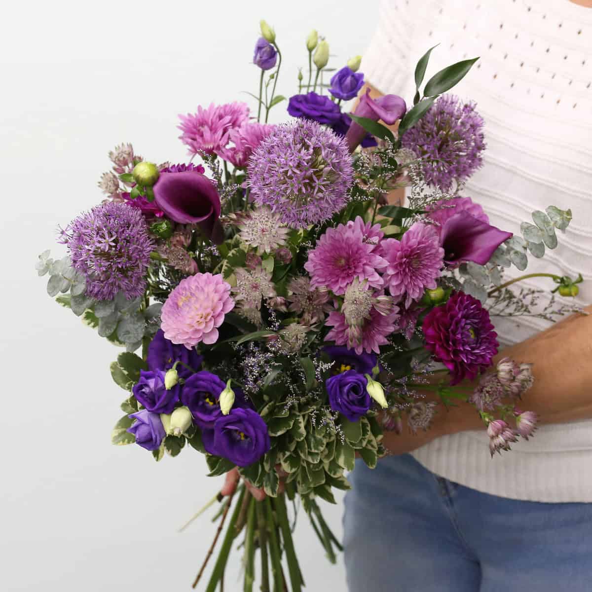 Summer Amethyst bouquet with purple allium, calla lilies, lisianthus and seasonal flowers