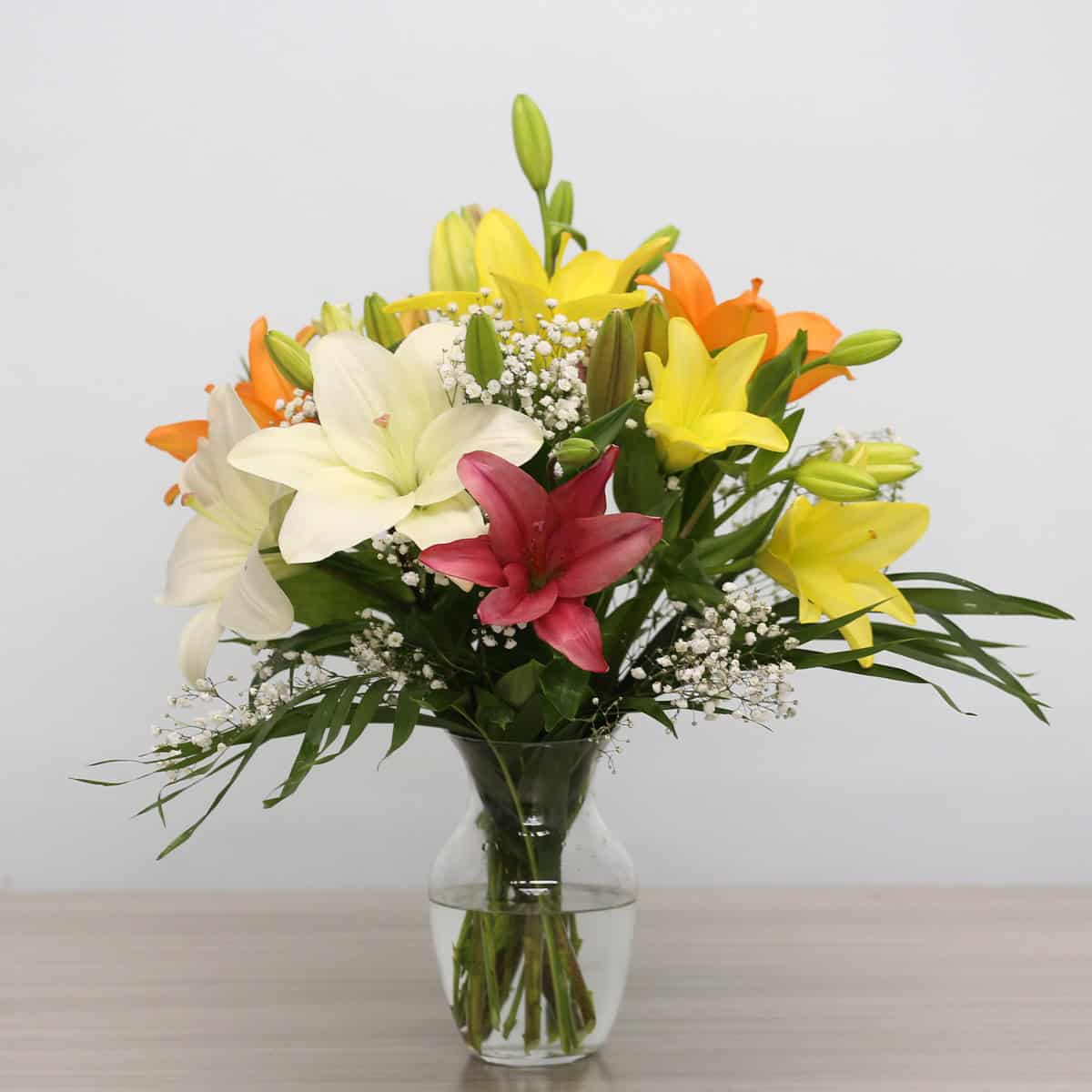 Standard Asiatic lily bouquet in vase with colourful unscented lilies by Le Bouquet Montreal