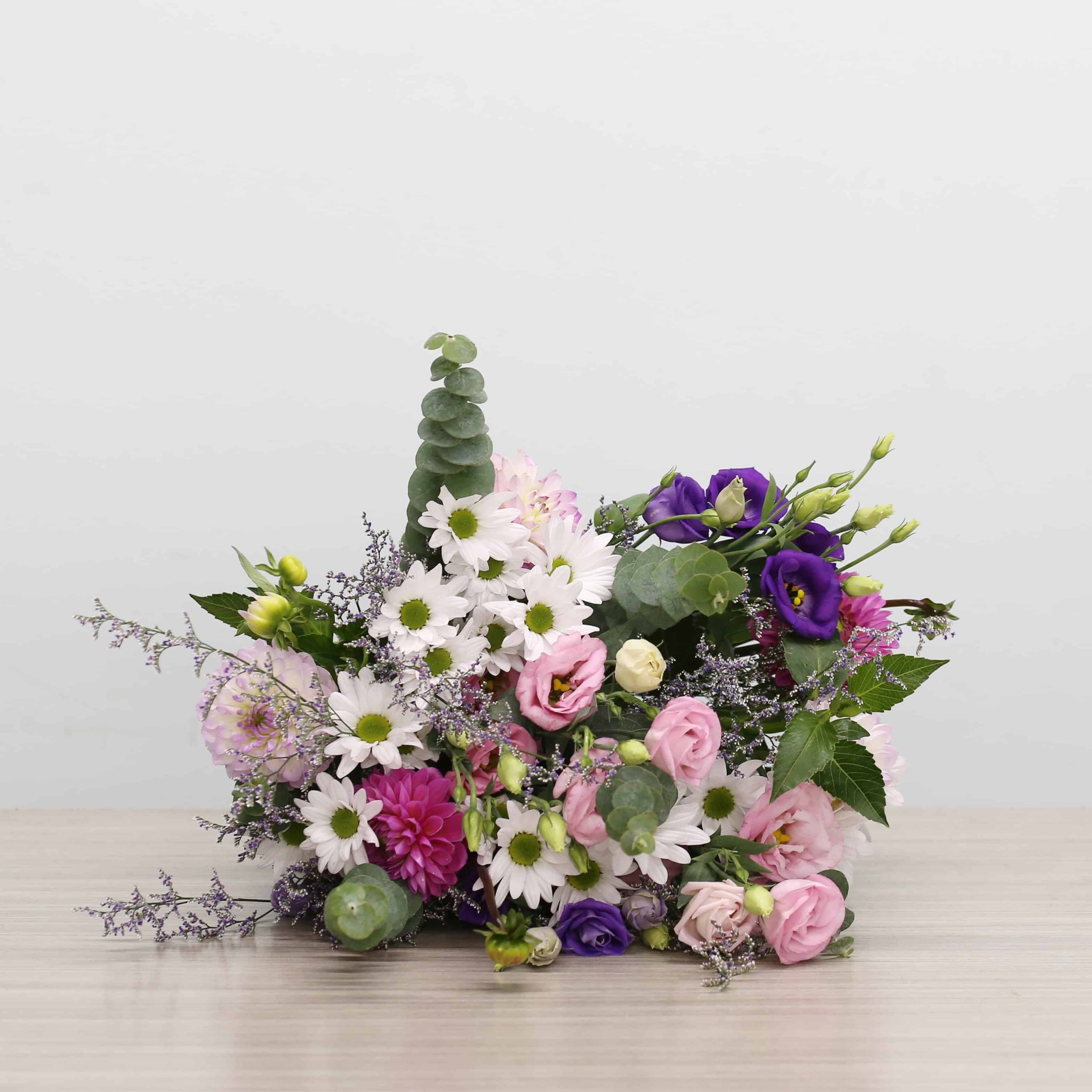 Ariana Premium Bouquet with pink and lavender dahlias, lisianthus, white daisies, caspia and eucalyptus