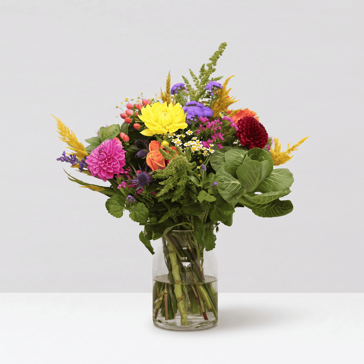 Countryside Charm dahlia and wildflower bouquet arranged in a clear glass vase