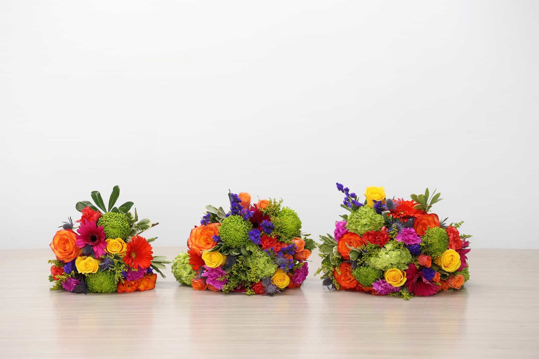 Heatwave Bouquet size comparison showing Standard, Deluxe and Premium colourful bouquets from left to right