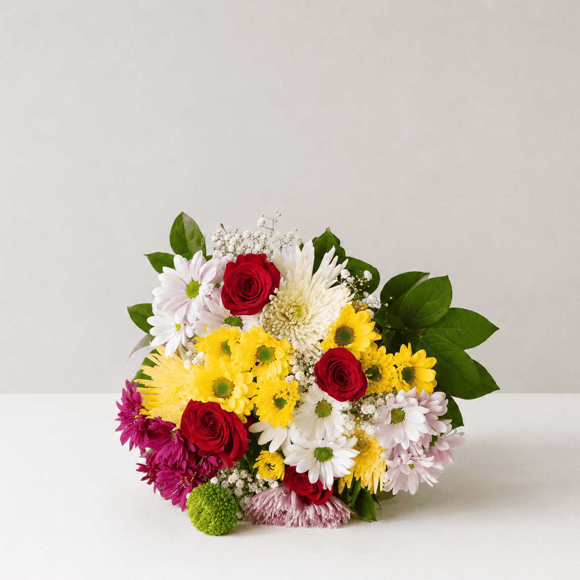 Hollandia Daisy Bouquet with red roses, assorted daisies, Fuji chrysanthemums, baby's breath and greenery.